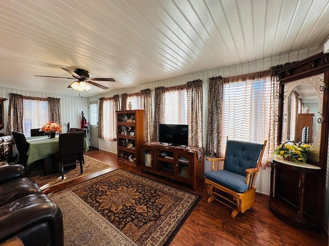 living room with hardwood / wood-style flooring and ceiling fan