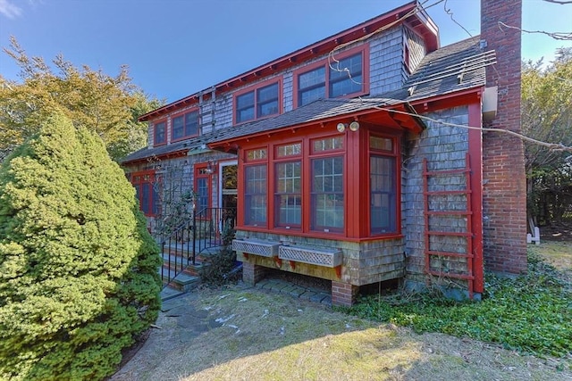 view of side of home with a chimney