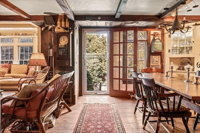 interior space featuring beam ceiling and hardwood / wood-style floors