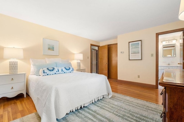 6 Lancaster Pl, Andover, MA 01810 - bedroom with light wood finished floors, baseboards, and a closet