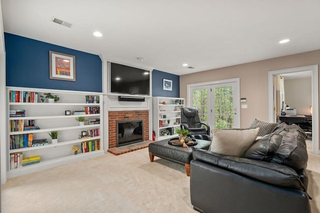 living room featuring carpet floors, a fireplace, and recessed lighting