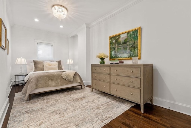 bedroom with crown molding, baseboards, dark wood-style flooring, and baseboard heating