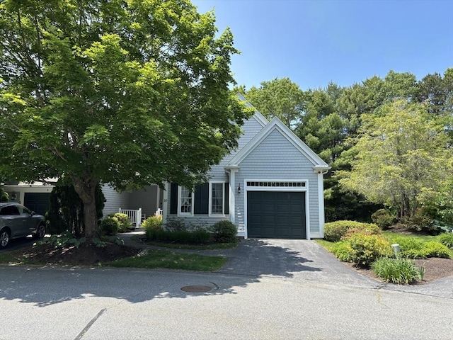 10 Mayfair Ct Unit 10, Mashpee, MA 02649 - obstructed view of property with a garage and driveway