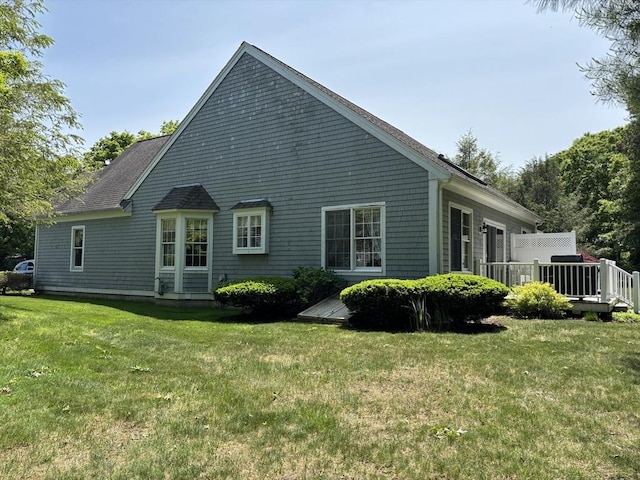 10 Mayfair Ct Unit 10, Mashpee, MA 02649 - rear view of property featuring a lawn and a deck