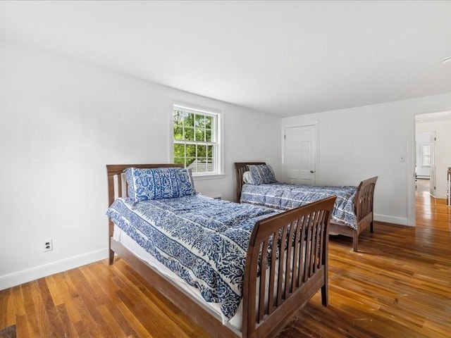 234 Lowell Rd, Wellesley, MA 02481 - bedroom with baseboards and wood finished floors