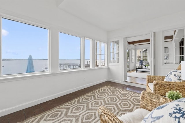 sunroom featuring baseboards