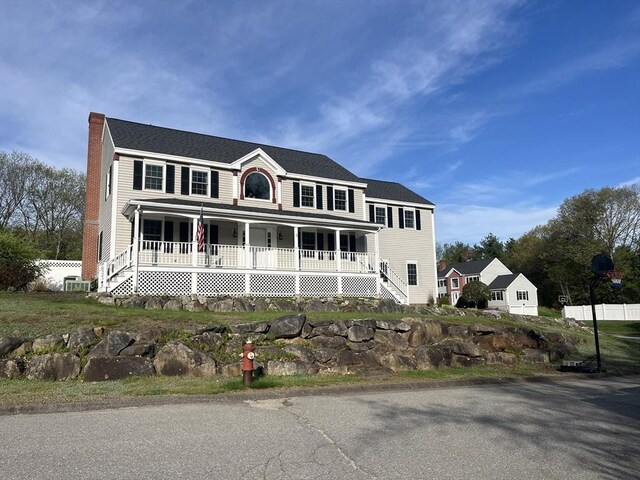34 Liberty Ln, Ashburnham, MA 01430 - colonial-style house featuring a porch and a chimney