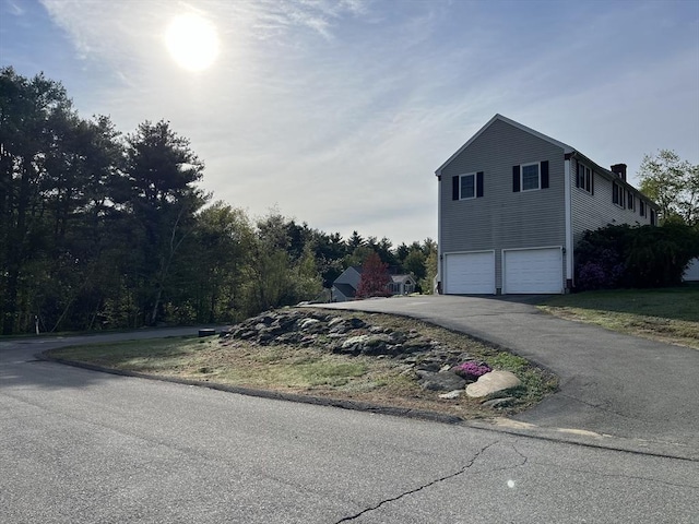 34 Liberty Ln, Ashburnham, MA 01430 - view of property exterior with an attached garage and asphalt driveway