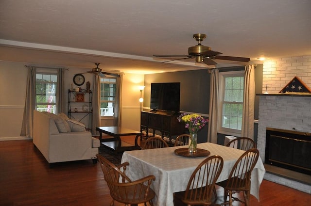 34 Liberty Ln, Ashburnham, MA 01430 - dining area with a ceiling fan, wood finished floors, a fireplace, and healthy amount of natural light