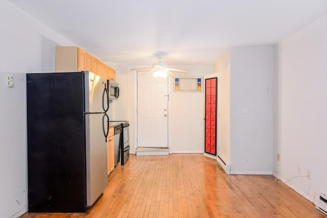 kitchen featuring light brown cabinetry, light hardwood / wood-style flooring, appliances with stainless steel finishes, ceiling fan, and a baseboard heating unit