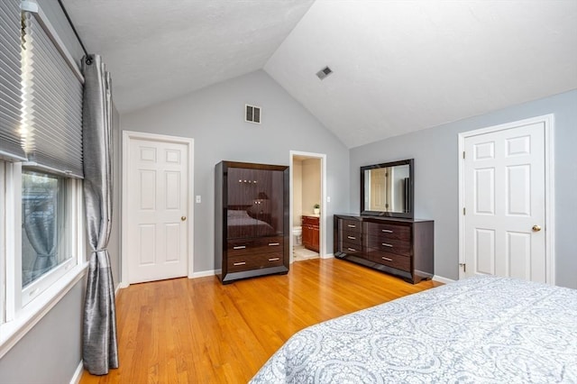 bedroom with light wood-type flooring, baseboards, and visible vents