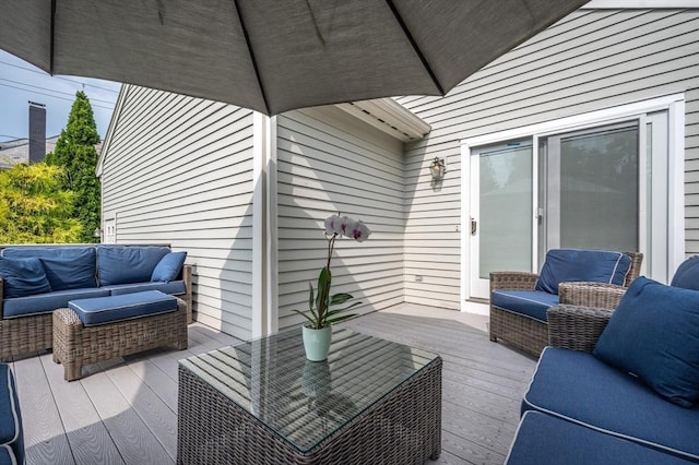 wooden terrace featuring an outdoor living space