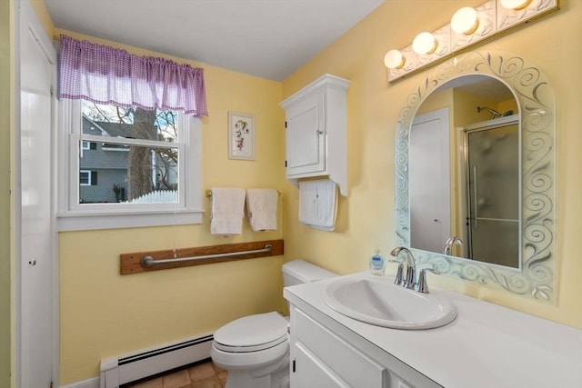 bathroom with baseboard heating, vanity, toilet, and a shower with door