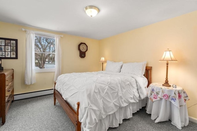 bedroom with carpet and a baseboard heating unit