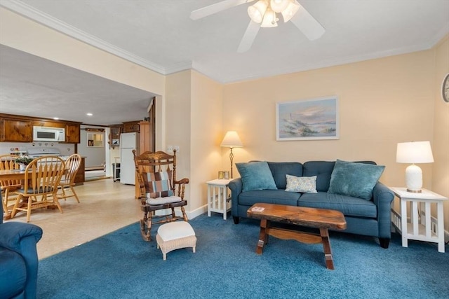 living room featuring crown molding and ceiling fan