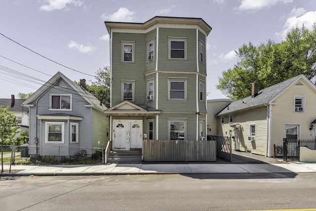 townhome / multi-family property featuring fence and a gate