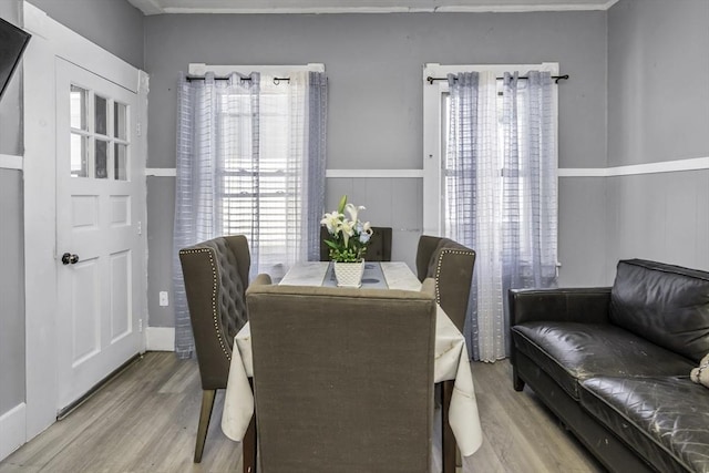 dining area with wood finished floors