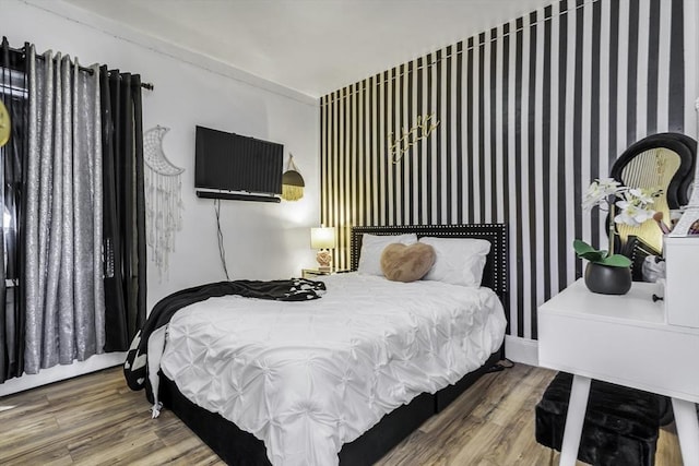 bedroom featuring wood finished floors