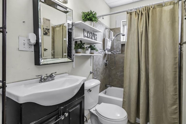 bathroom featuring toilet, shower / tub combo with curtain, and vanity