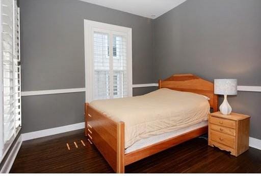 bedroom featuring dark hardwood / wood-style flooring