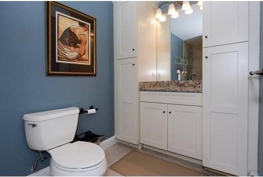 bathroom featuring toilet and vanity