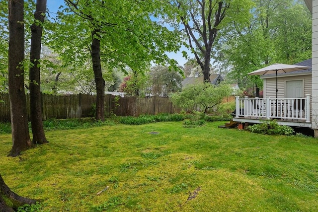 view of yard with a wooden deck