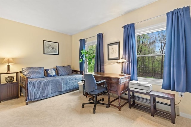 bedroom with carpet and an office area