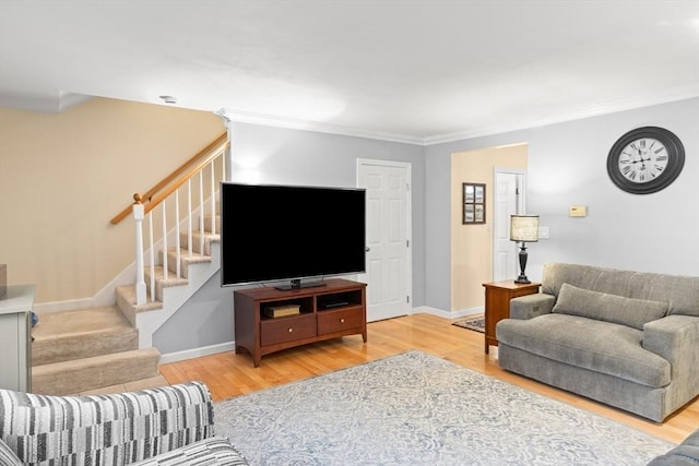 living room with stairway, wood finished floors, crown molding, and baseboards
