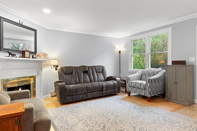 living area featuring crown molding, a warm lit fireplace, recessed lighting, and baseboards