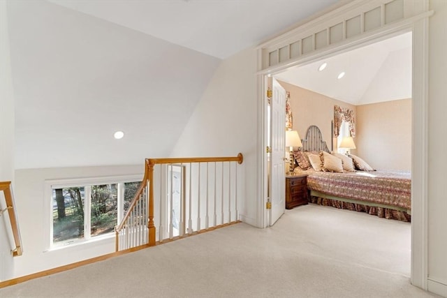 bedroom featuring lofted ceiling and carpet floors