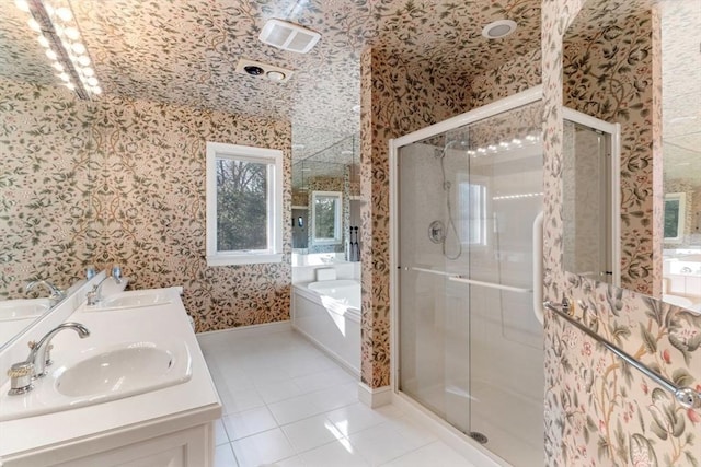 bathroom with tile patterned floors, separate shower and tub, and vanity