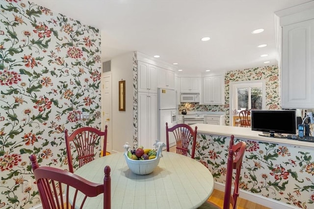 dining room with light wood-type flooring