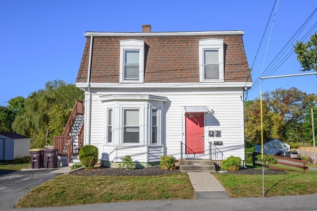 view of front of home with a front yard