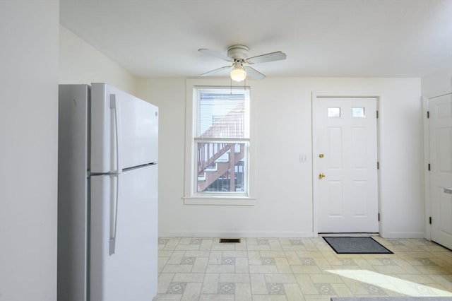 entrance foyer featuring ceiling fan