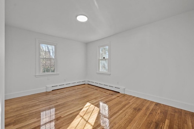 unfurnished room with light wood-type flooring