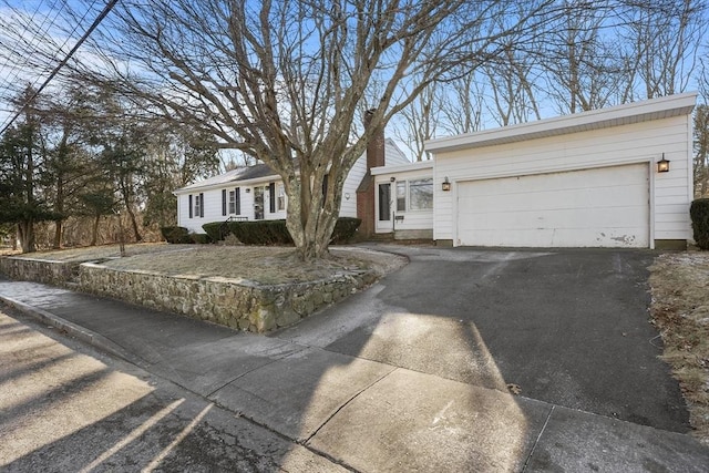 single story home featuring a garage