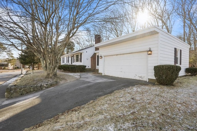 single story home featuring a garage