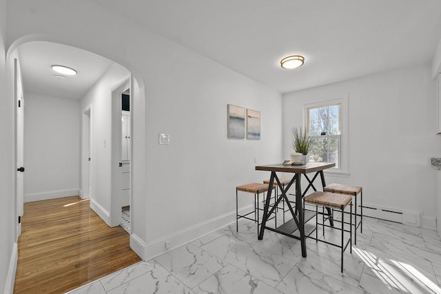 dining area with baseboard heating