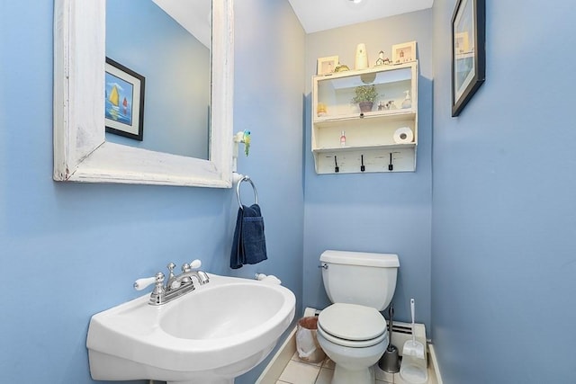 311 Main St, Franklin, MA 02038 - bathroom featuring a sink, toilet, and tile patterned flooring