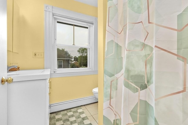 311 Main St, Franklin, MA 02038 - full bath featuring a baseboard heating unit, vanity, toilet, tile patterned floors, and a shower with curtain