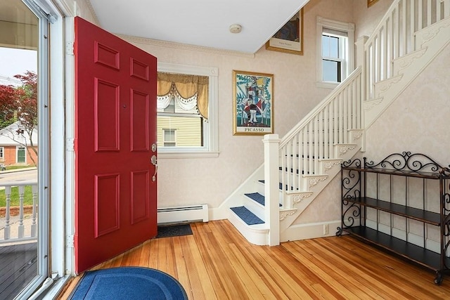 311 Main St, Franklin, MA 02038 - foyer featuring a baseboard radiator, wood finished floors, plenty of natural light, and wallpapered walls