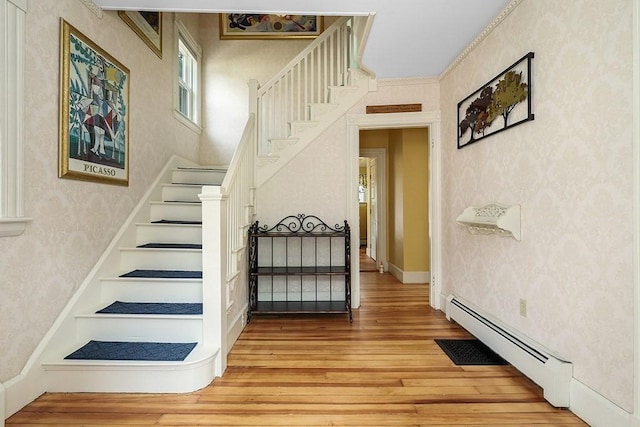 311 Main St, Franklin, MA 02038 - stairs with wallpapered walls, wood-type flooring, and a baseboard radiator