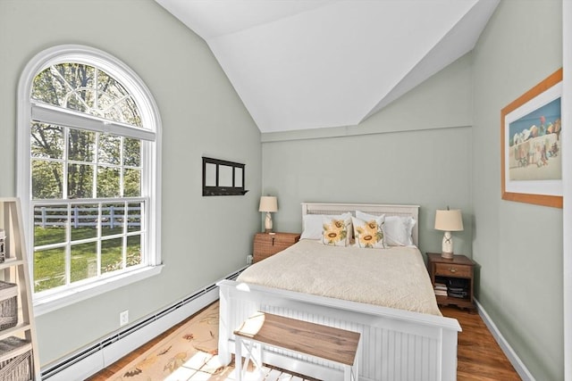 16 W Wind Acres, Norwell, MA 02061 - bedroom with a baseboard heating unit, vaulted ceiling, and wood finished floors