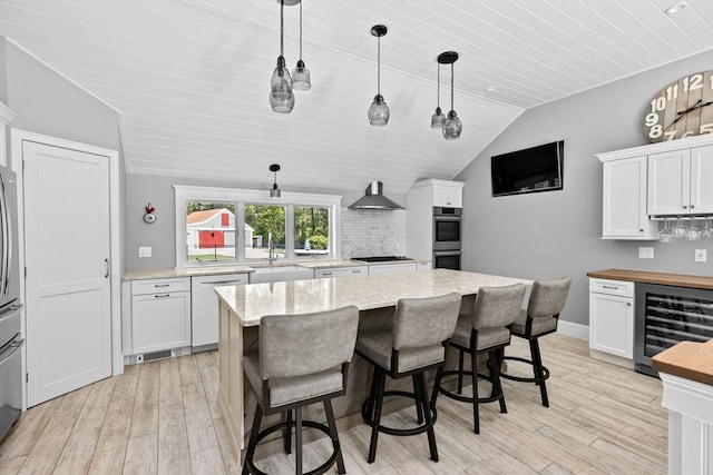 16 W Wind Acres, Norwell, MA 02061 - kitchen with beverage cooler, dishwasher, vaulted ceiling, white cabinets, and light wood finished floors