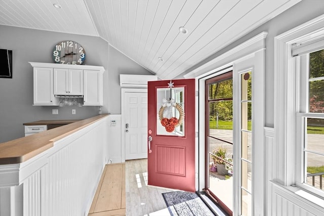 16 W Wind Acres, Norwell, MA 02061 - kitchen featuring vaulted ceiling, wood ceiling, white cabinets, a wall mounted AC, and light wood-style floors
