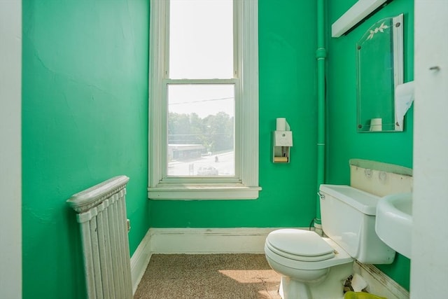 bathroom with radiator and toilet