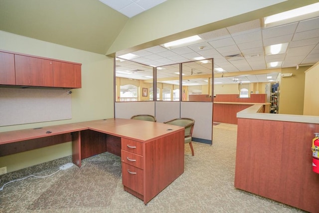 carpeted office with a drop ceiling