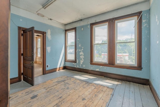 unfurnished room featuring light hardwood / wood-style flooring