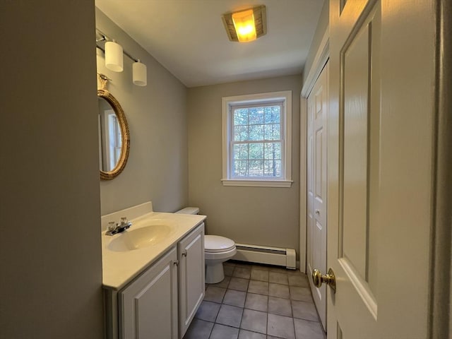 bathroom with a baseboard radiator, tile patterned flooring, vanity, and toilet