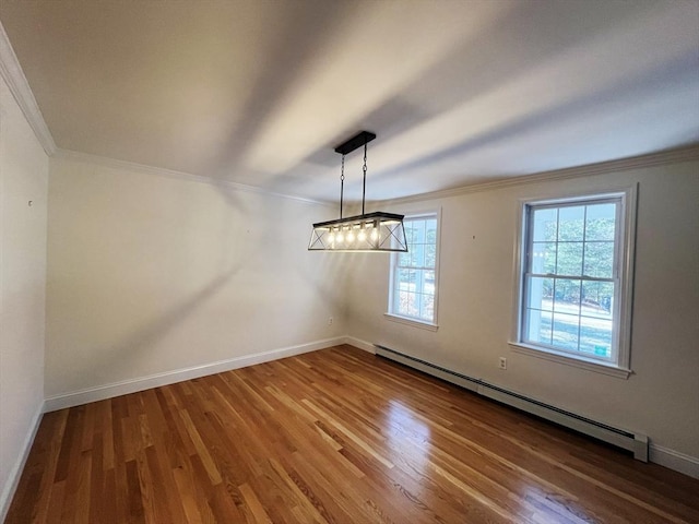 unfurnished dining area with baseboards, a baseboard radiator, ornamental molding, and wood finished floors